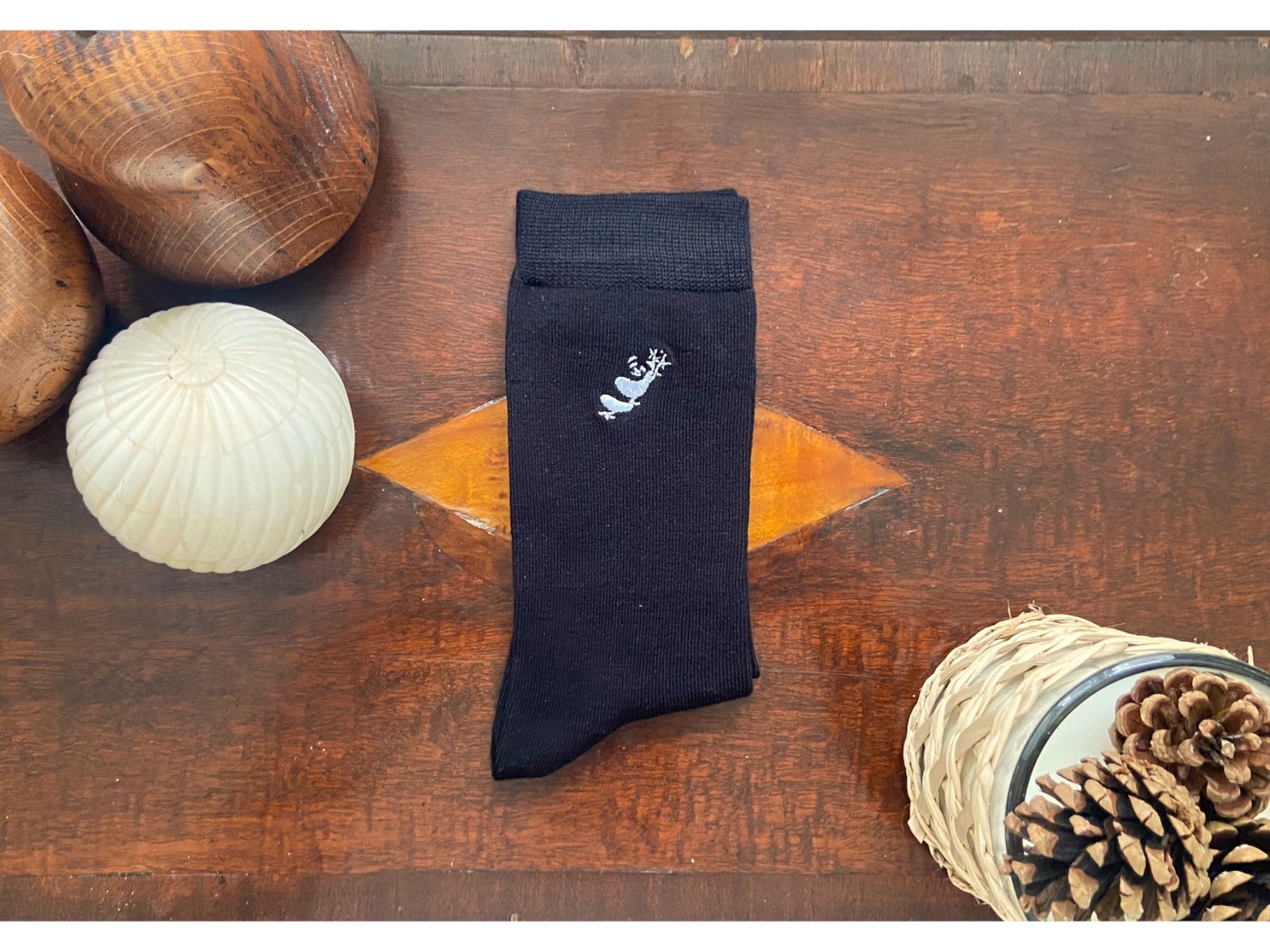 black bamboo socks on a wooden top